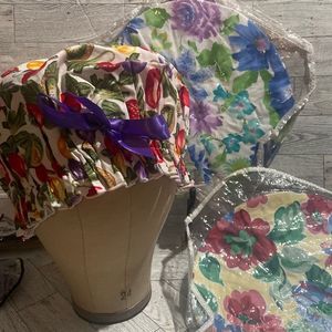 3 shower caps with vinyl lining all with a bow floral patterns